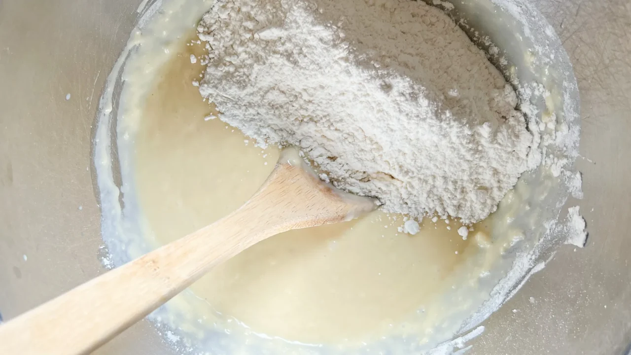 bowl with spoon and cinnamon roll ingredients