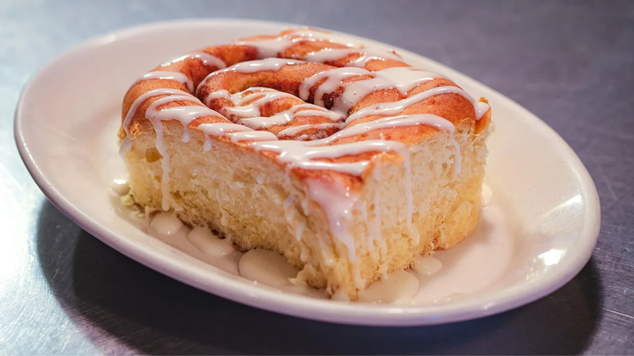 side view of a cinnamon roll from the farmhouse cafe in omaha nebraska
