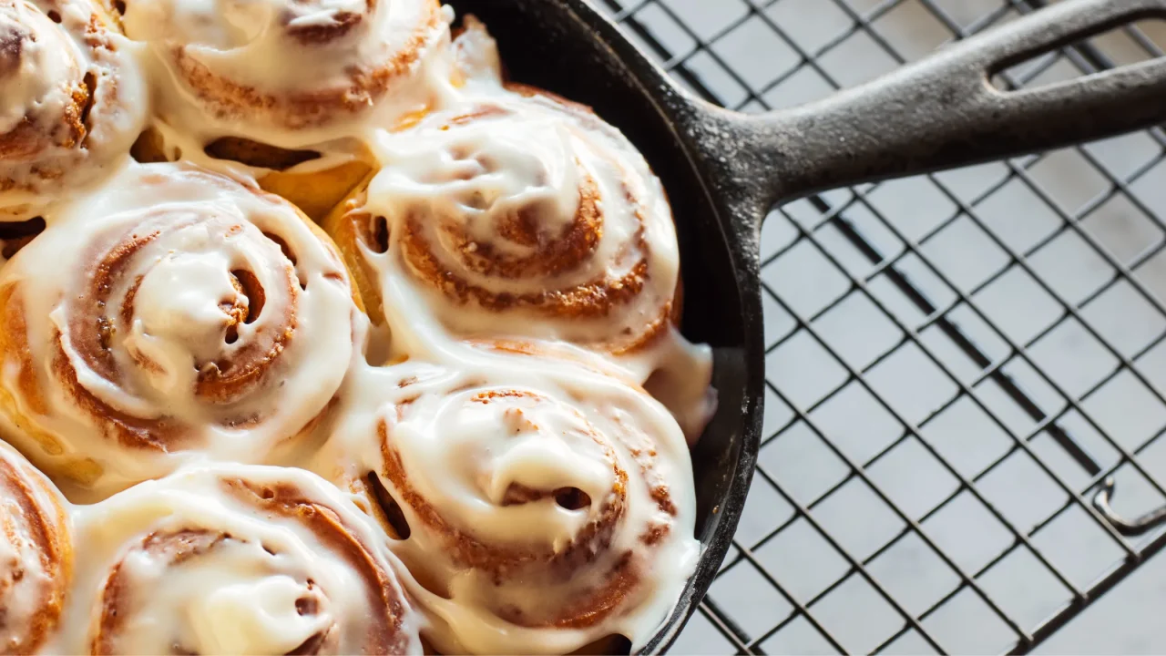 world's best cinnamon rolls in a black cast iron skillet