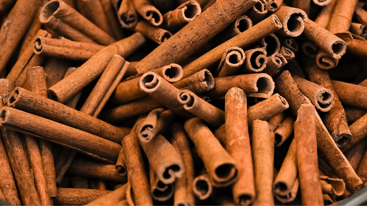 many cinnamon sticks laying together